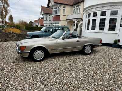 1986  MERCEDES 300 SL AUTO SMOKE SILVER  /  BROWN LEATHER NICE RUST FREE